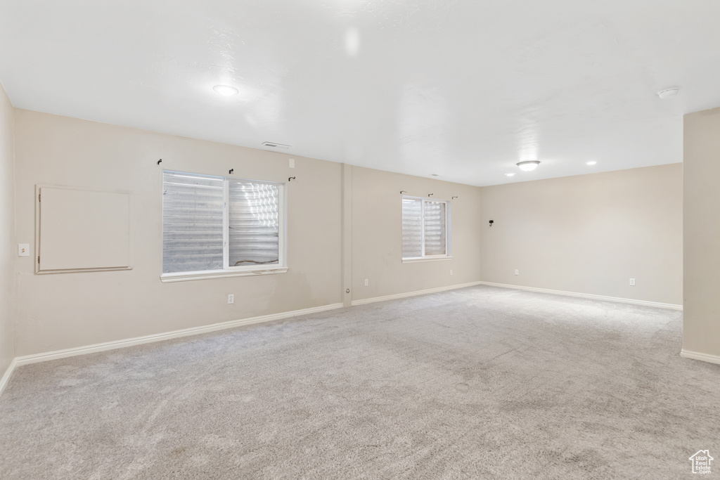 Unfurnished room with carpet and baseboards