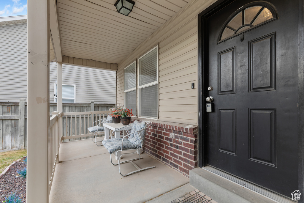 Property entrance with covered porch