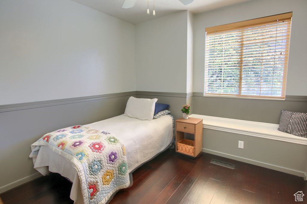 Bedroom with wood finished floors and ceiling fan