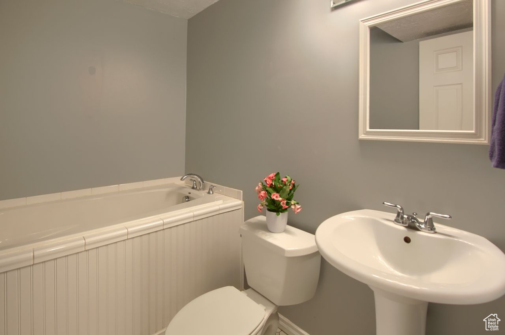 Bathroom with a bath and toilet