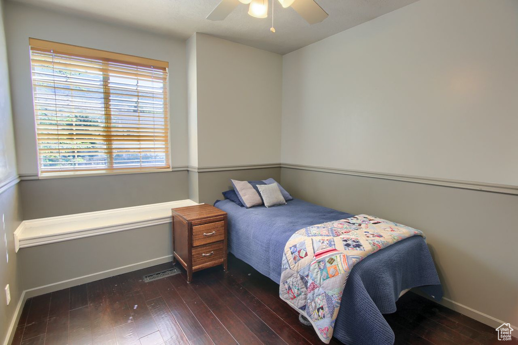 Bedroom with hardwood / wood-style flooring and a ceiling fan