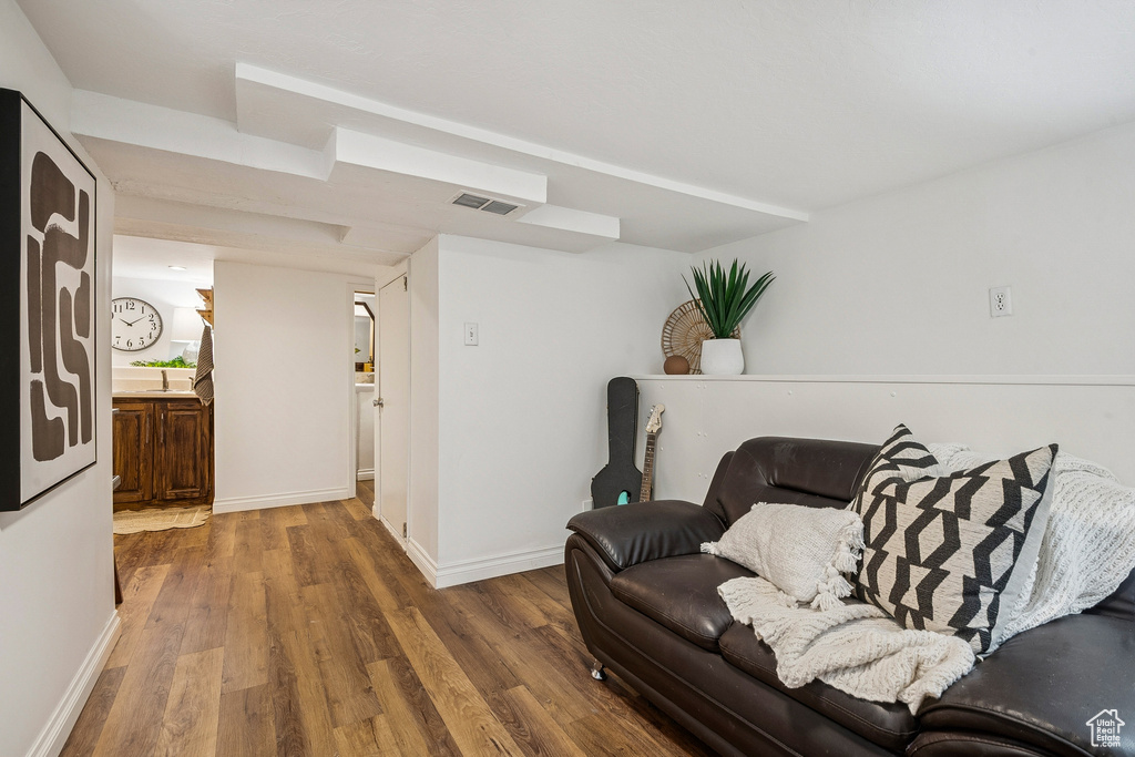 Living room featuring wood finished floors and baseboards