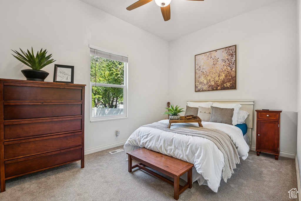 Bedroom featuring carpet flooring and ceiling fan