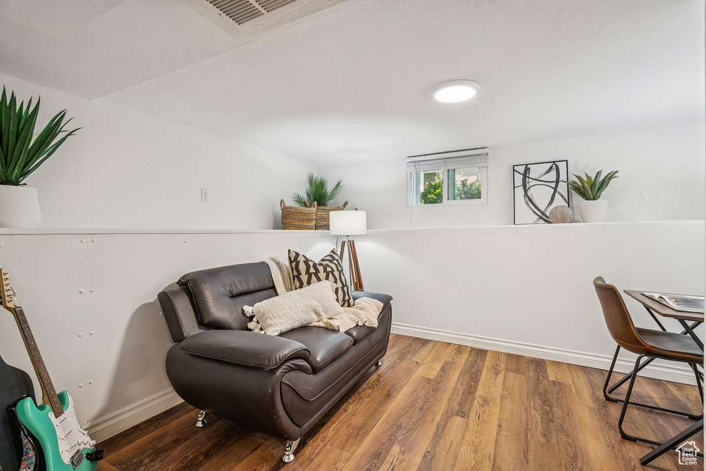 Living area featuring wood finished floors and baseboards