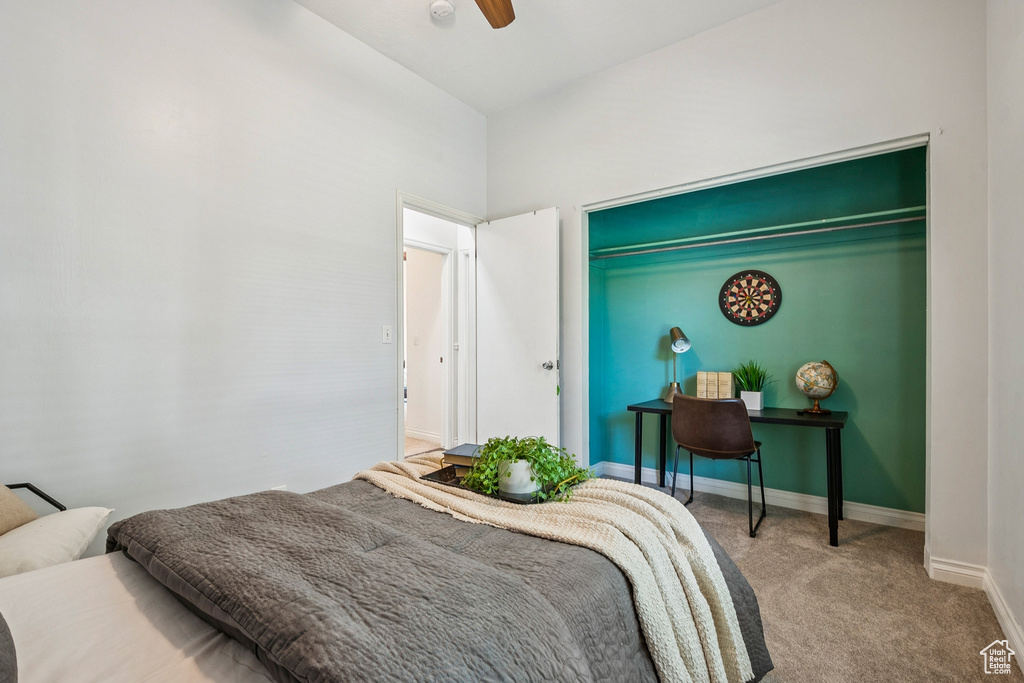 Bedroom with carpet flooring and a ceiling fan
