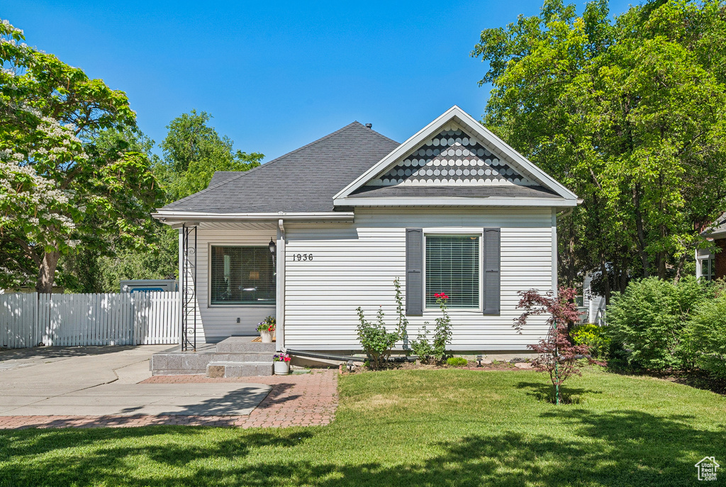 View of front of property featuring a shingled roof