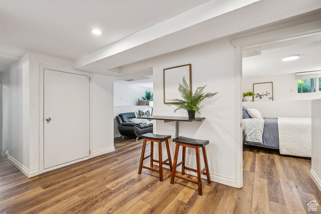 Hallway featuring wood finished floors and recessed lighting