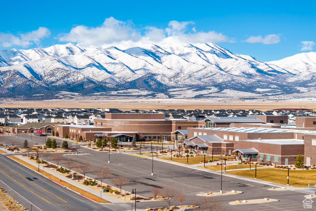 View of mountain backdrop featuring nearby suburban area