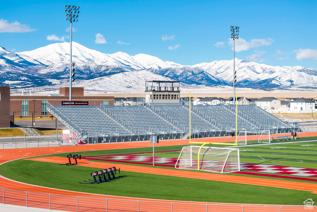 View of tennis court featuring a mountain view and an area for sports