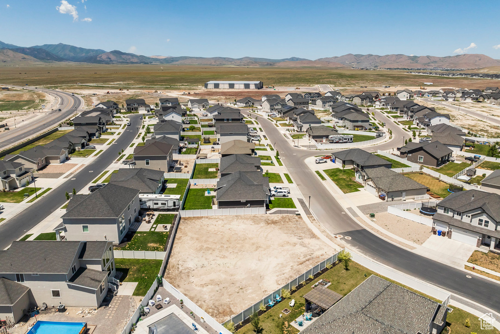 Aerial perspective of suburban area featuring a mountainous background
