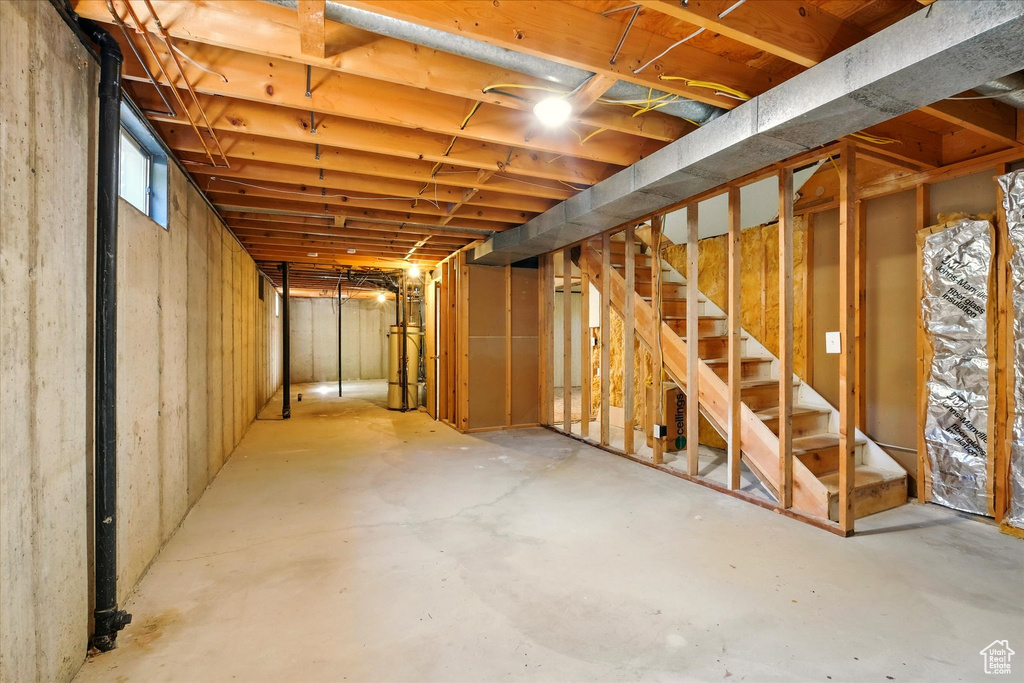 Below grade area with stairs and water heater