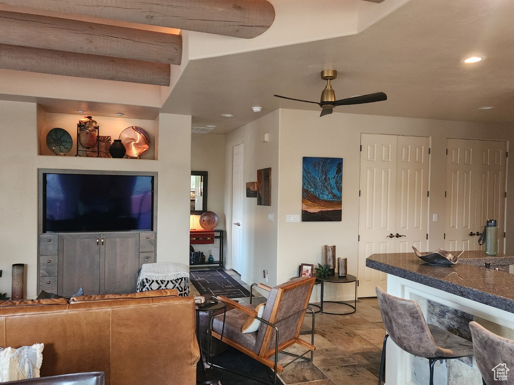 Living room featuring ceiling fan and recessed lighting