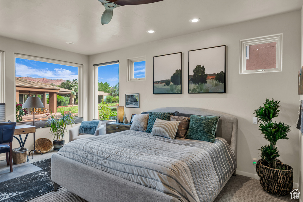 Carpeted bedroom with recessed lighting and ceiling fan