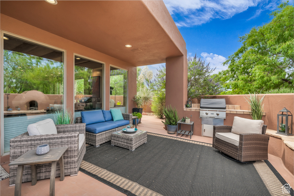 View of patio featuring an outdoor kitchen and outdoor lounge area