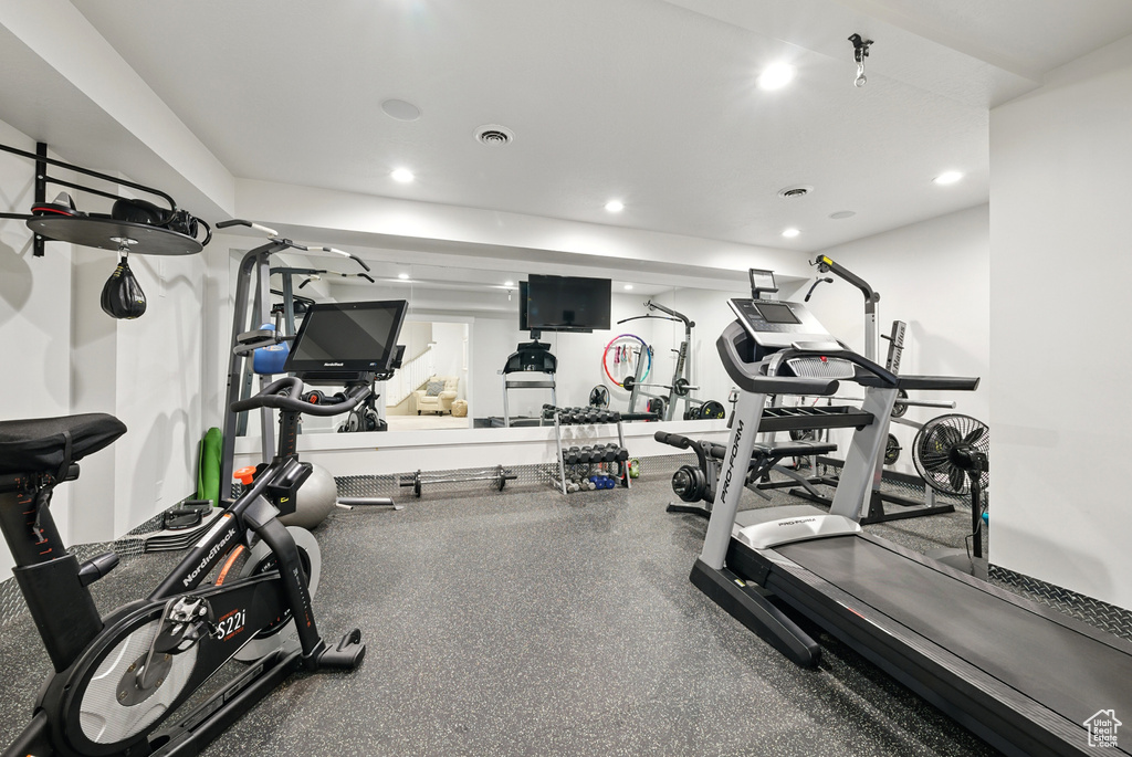 Workout area featuring recessed lighting