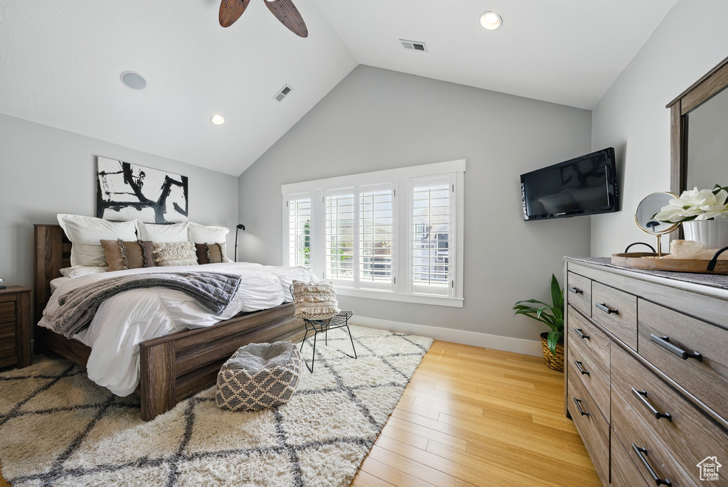 Bedroom featuring recessed lighting, light wood-style flooring, ceiling fan, and high vaulted ceiling
