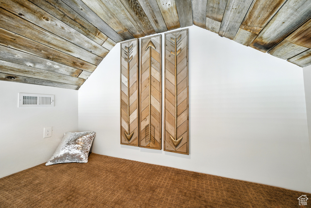 Detailed view of wooden ceiling and carpet flooring