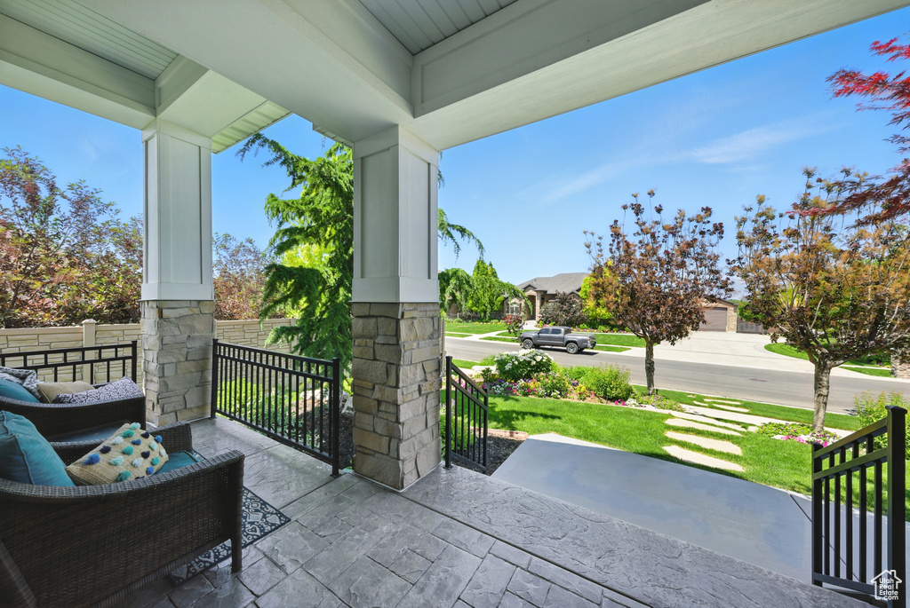 Covered porch with a yard