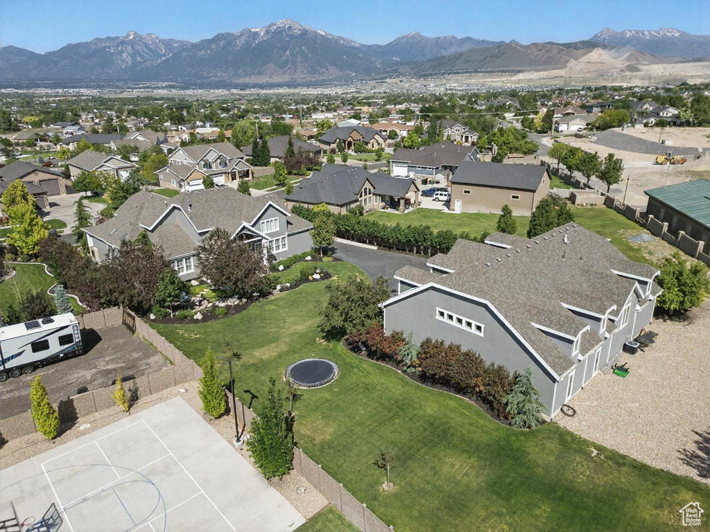 Aerial view of residential area featuring mountains