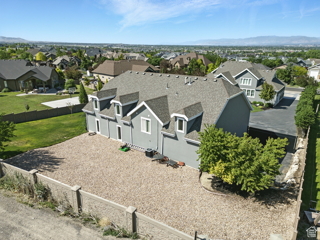 Aerial view of residential area featuring a mountain backdrop