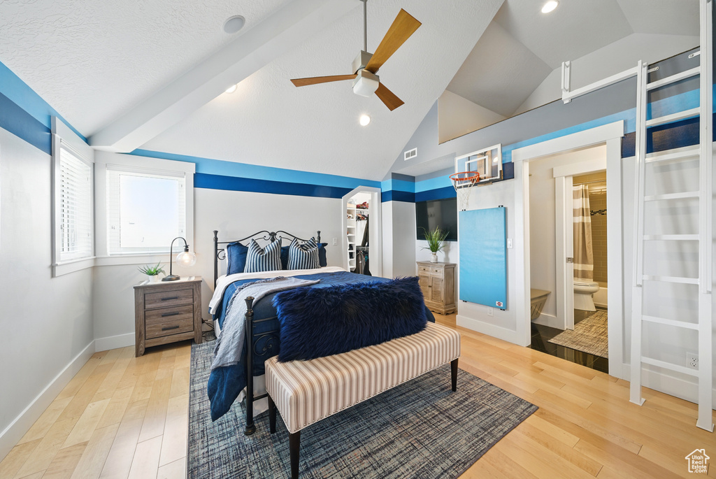Bedroom featuring lofted ceiling, light wood finished floors, a ceiling fan, recessed lighting, and a spacious closet