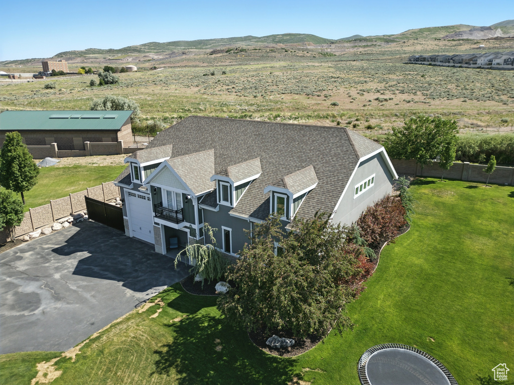 View of subject property featuring a mountainous background