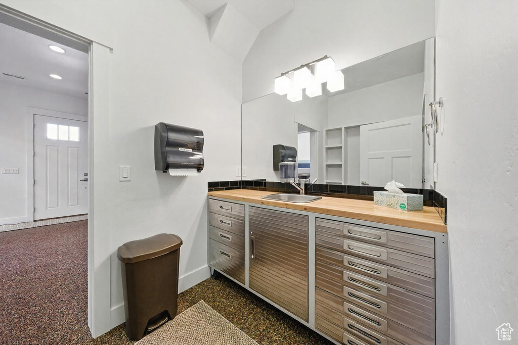 Bathroom featuring vanity and recessed lighting