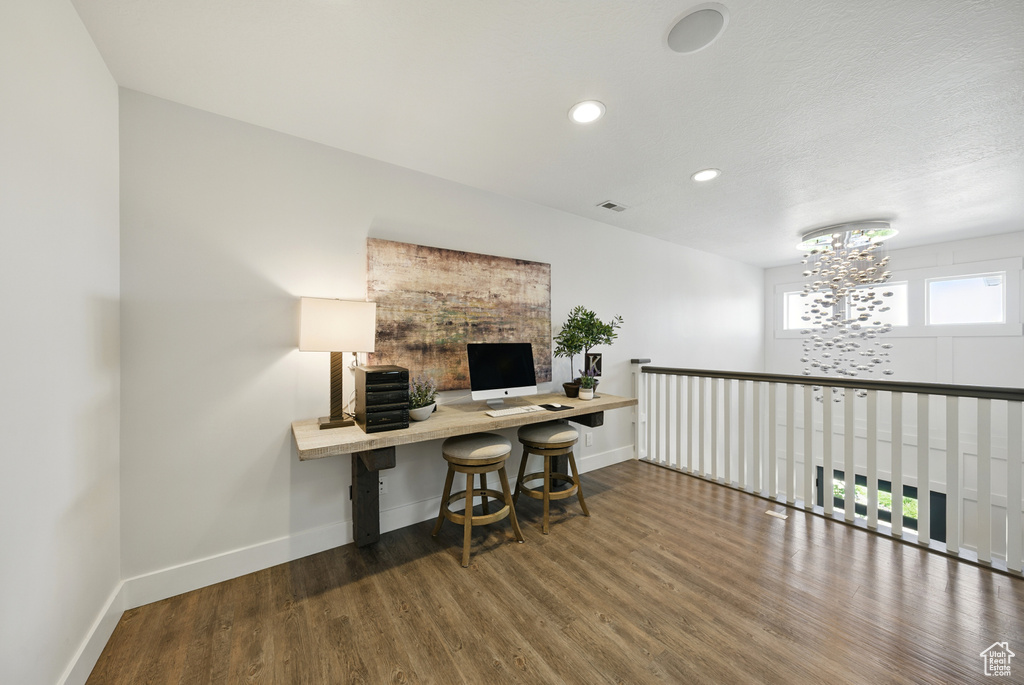 Office with wood finished floors, a chandelier, and recessed lighting