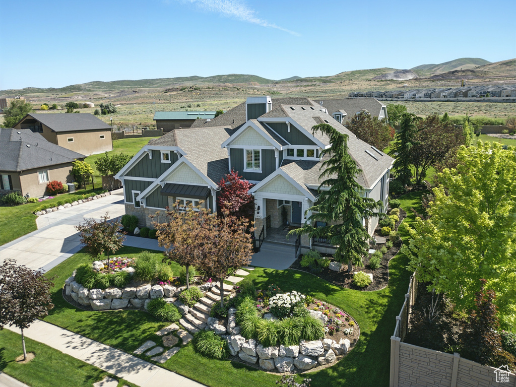 View of subject property featuring a mountainous background