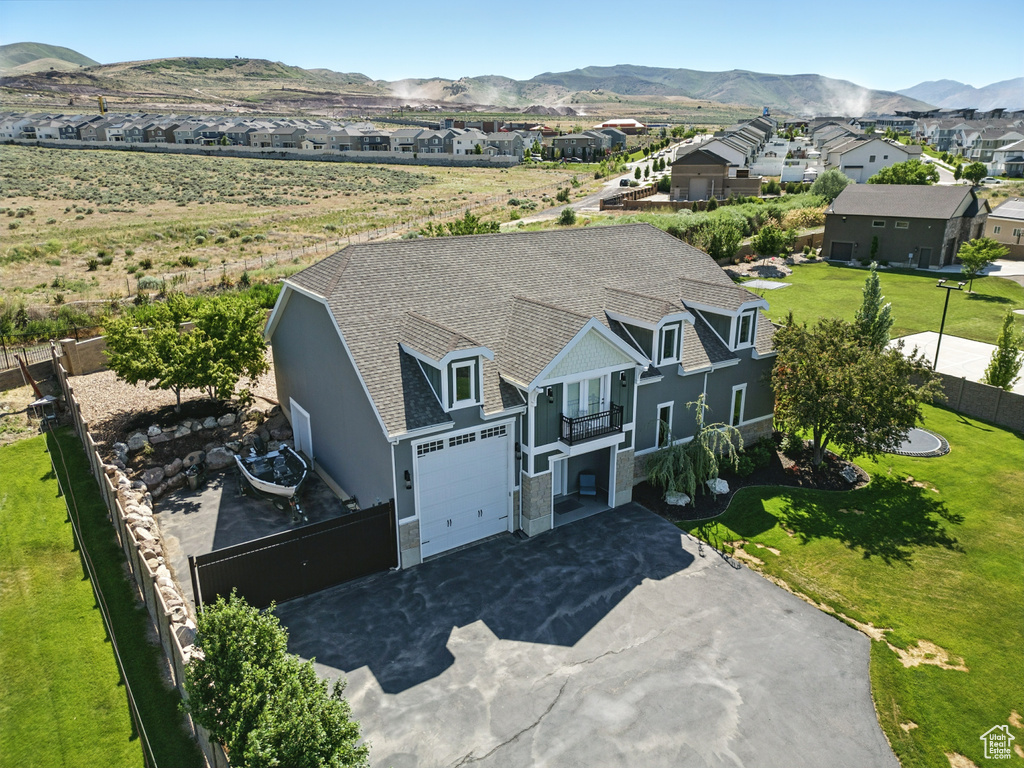 Aerial perspective of suburban area with a mountain backdrop