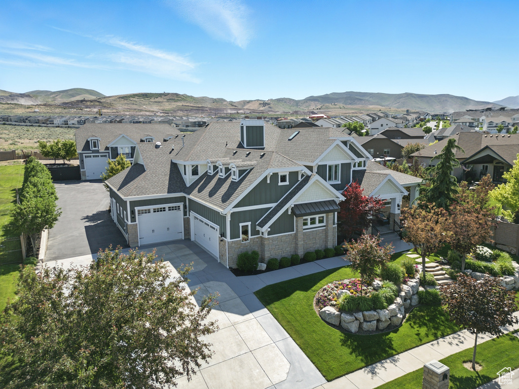 Aerial view of residential area featuring a mountain backdrop