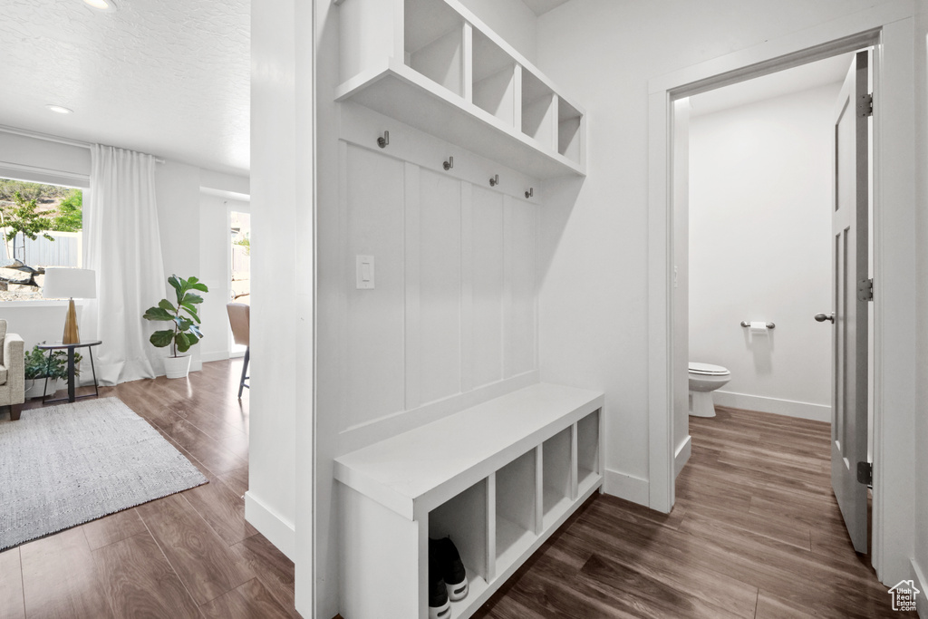 Mudroom with dark wood-style floors, recessed lighting, and a textured ceiling