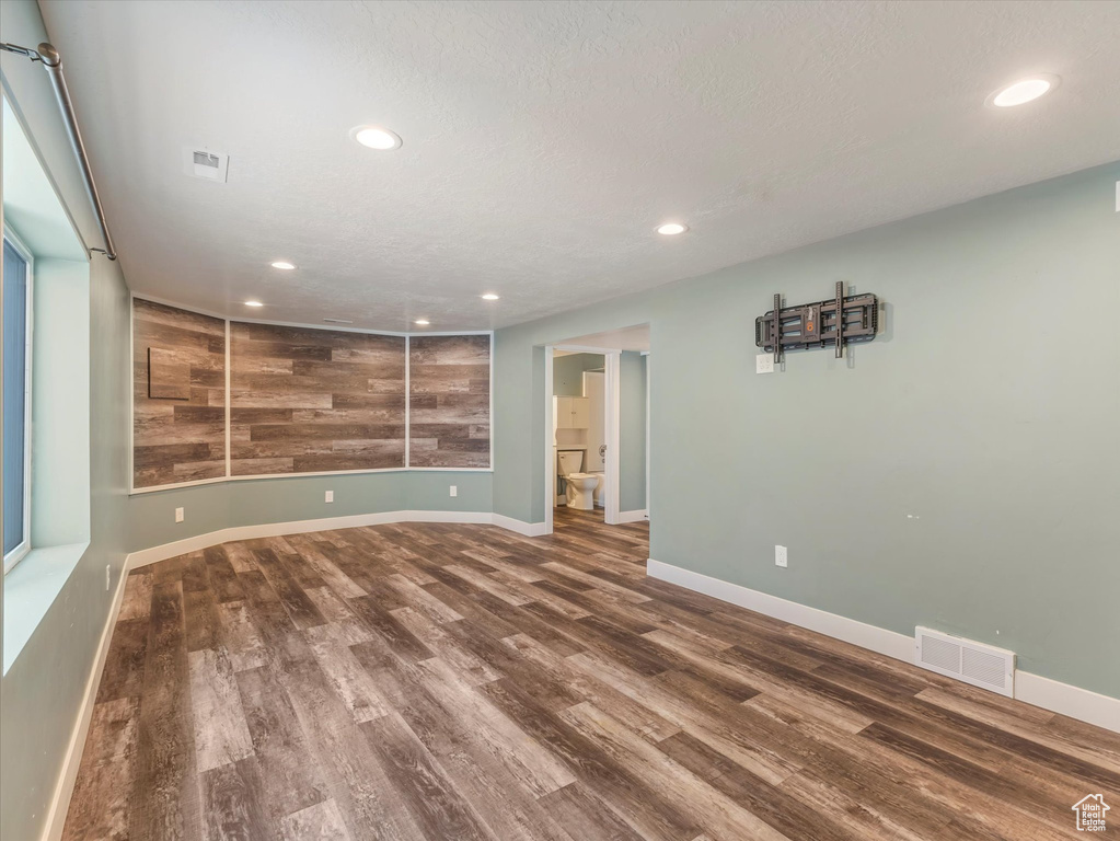 Unfurnished room featuring wood finished floors and recessed lighting