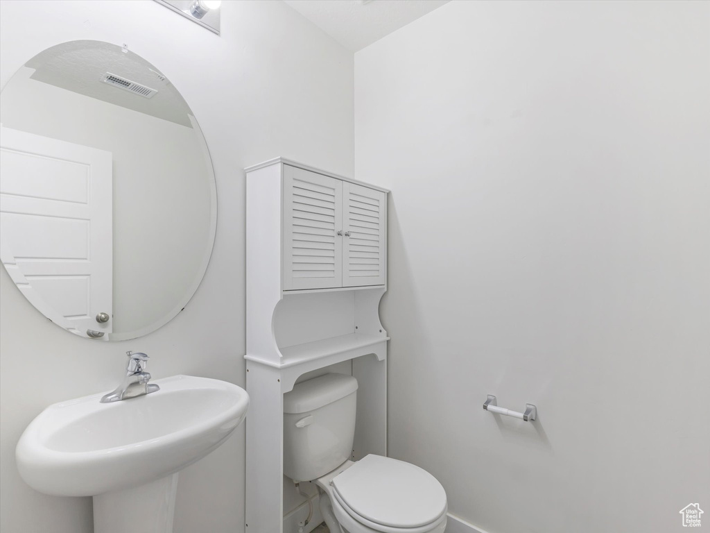 Bathroom with a sink and toilet