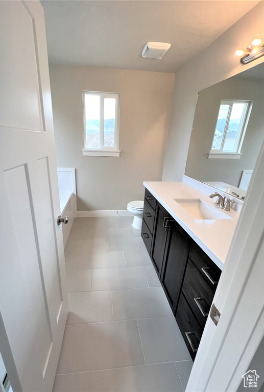 Bathroom with vanity and tile patterned flooring