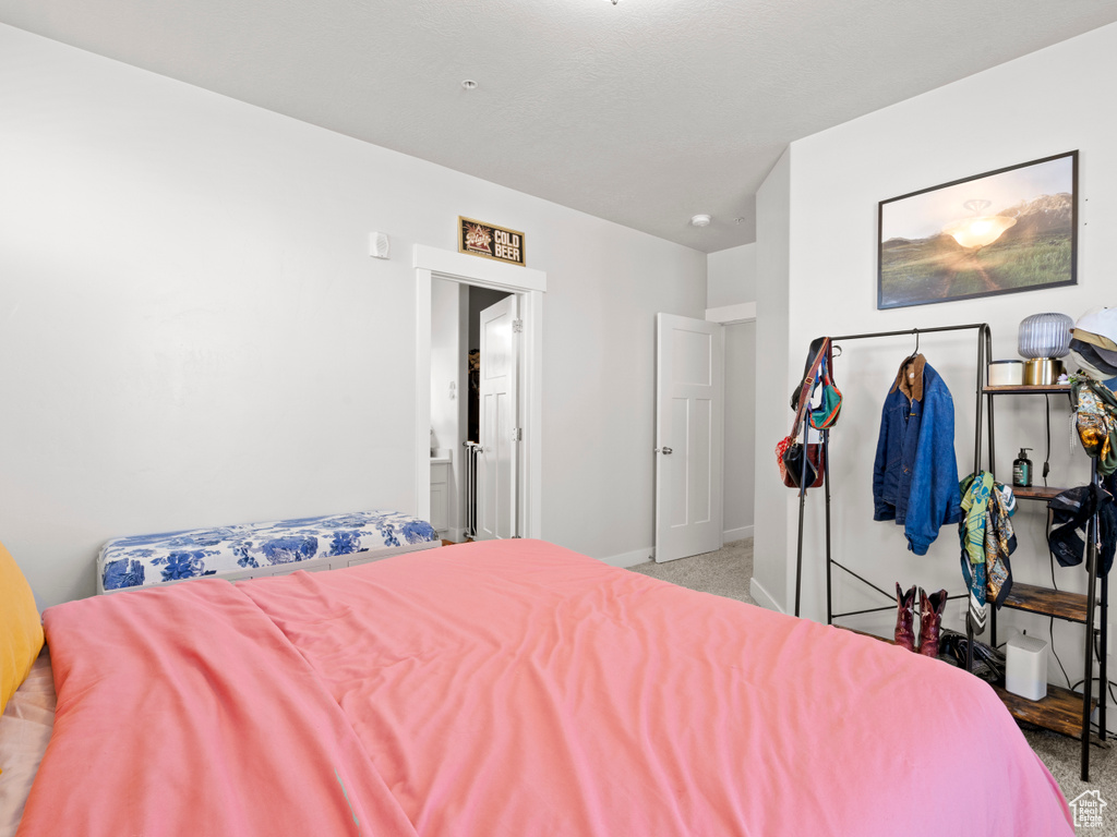 Carpeted bedroom with baseboards