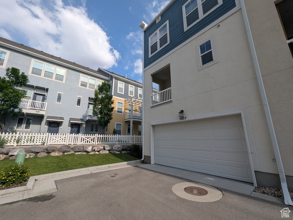View of home\\\\\\\'s exterior featuring stucco siding and a garage