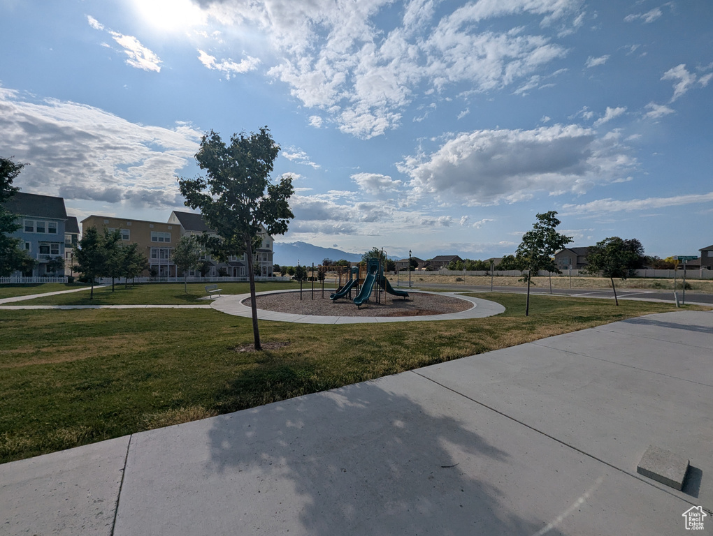 View of property\\\\\\\'s community featuring a lawn