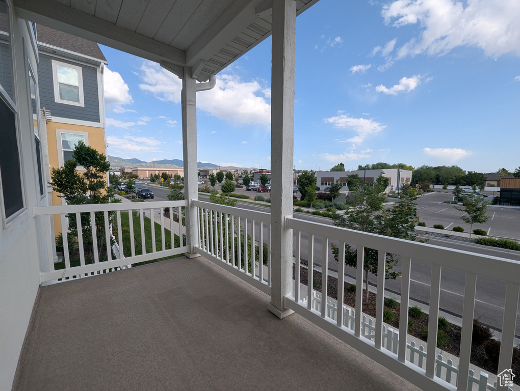 Balcony featuring a mountain view and a residential view