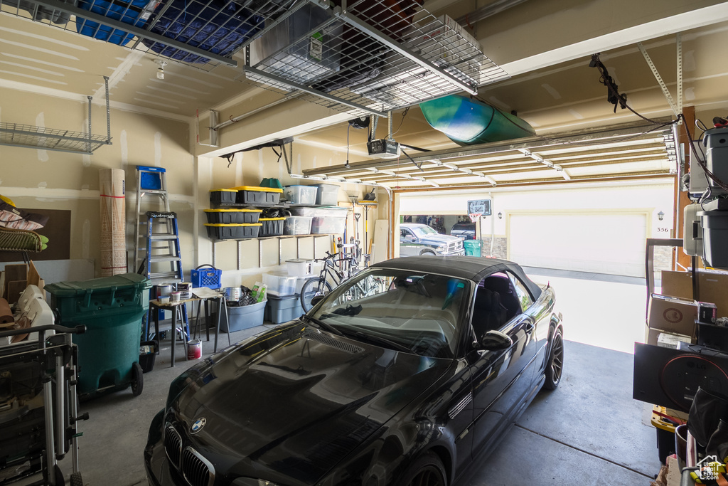 Garage featuring a garage door opener