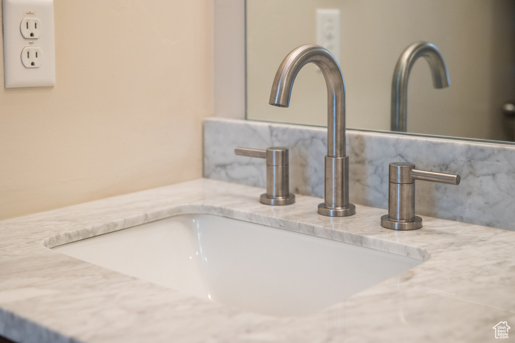 Bathroom view of decorative backsplash and vanity