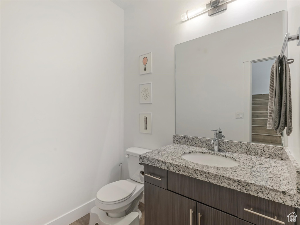 Bathroom with vanity and wood finished floors