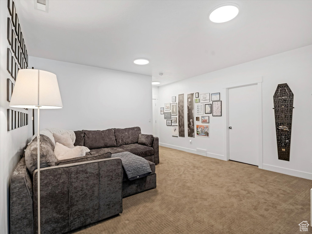 Living room with carpet and baseboards