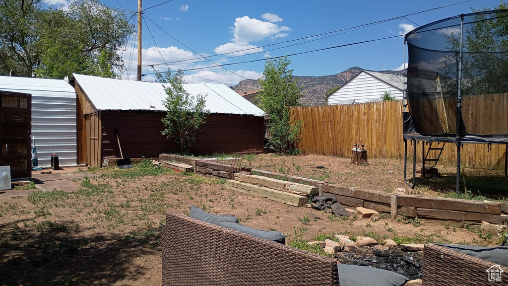 View of yard with a trampoline
