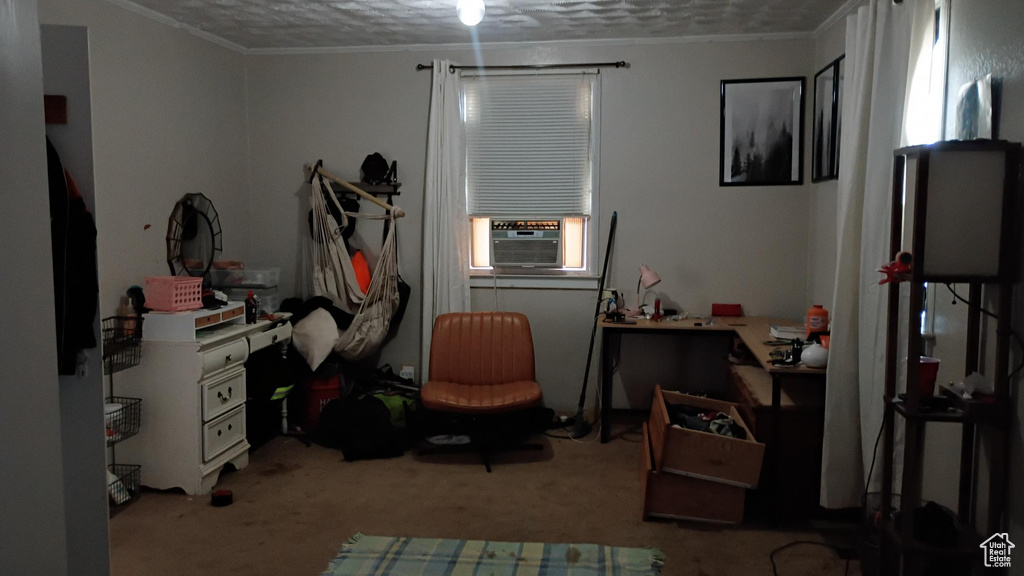 Carpeted bedroom featuring ornamental molding and cooling unit