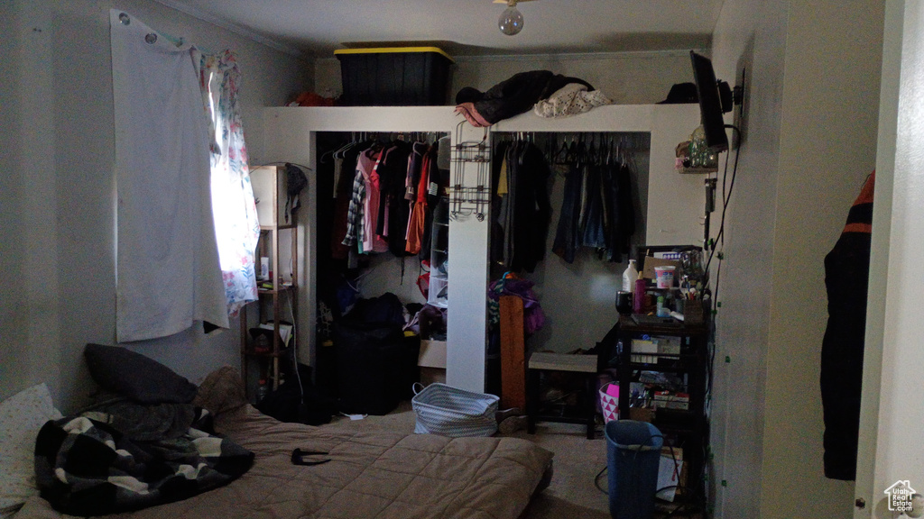 Bedroom featuring crown molding