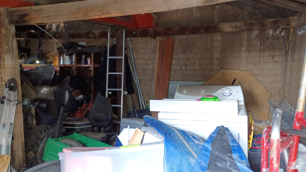 Storage area featuring separate washer and dryer