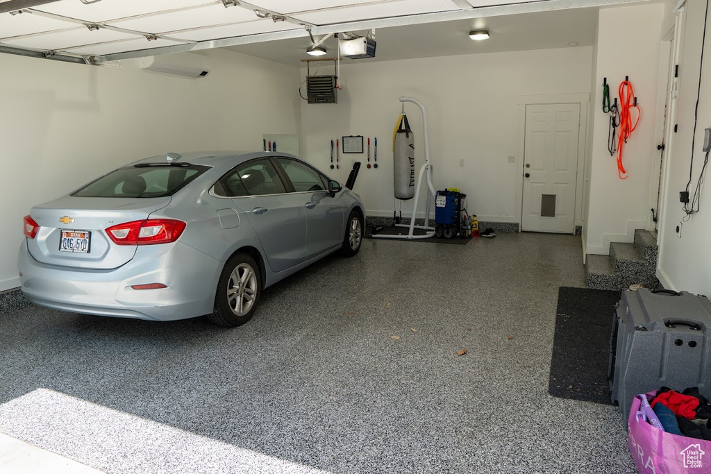 Garage featuring a garage door opener
