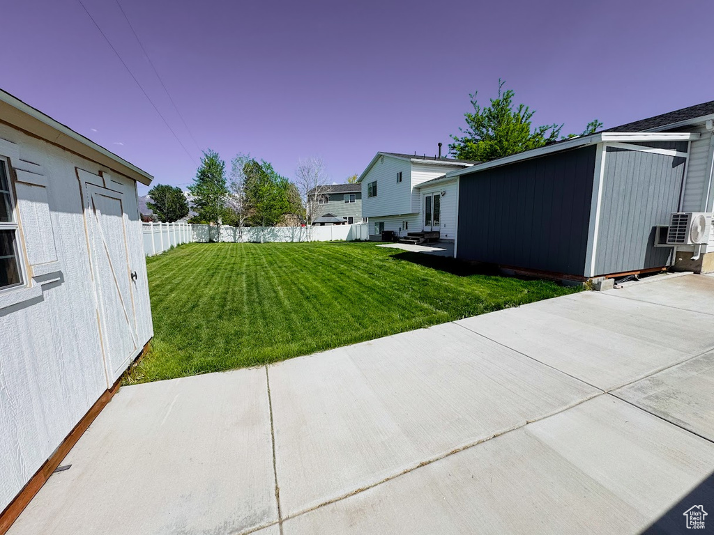View of yard with a patio and cooling unit