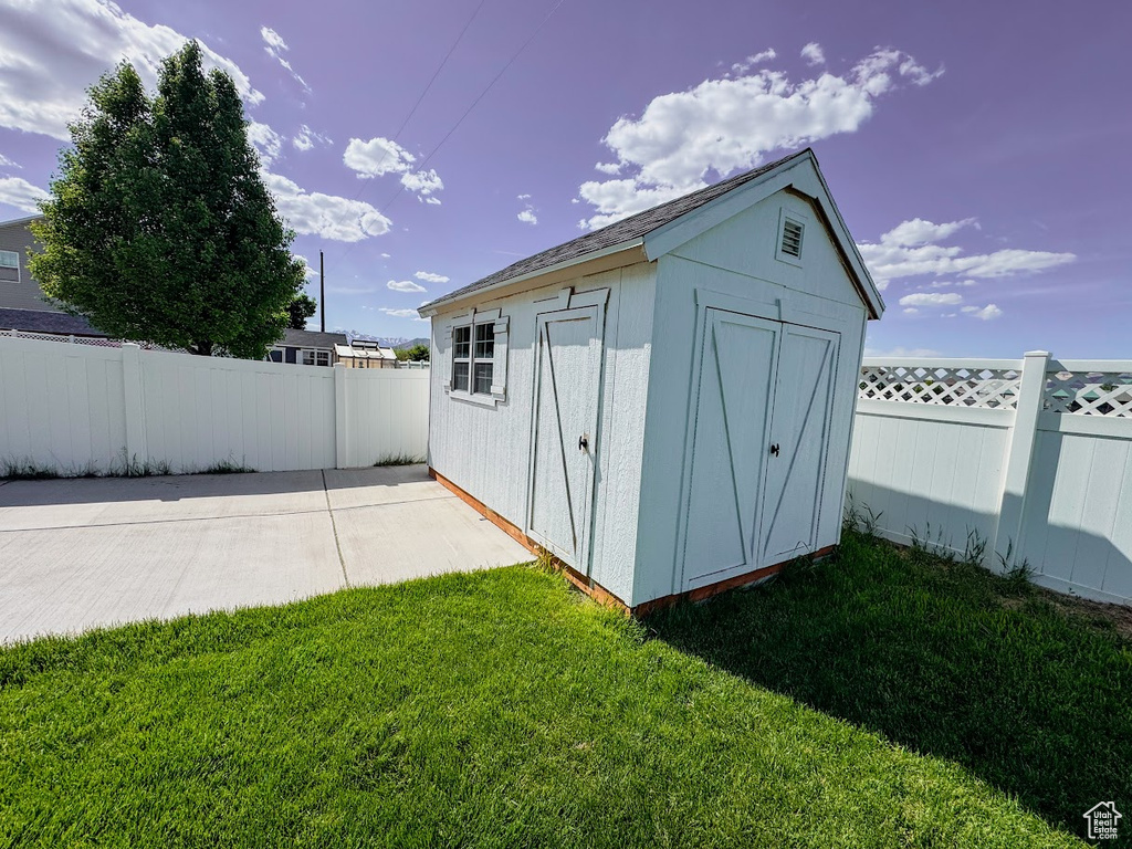 View of shed featuring a fenced backyard